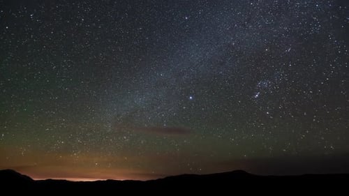 Glittering Stars and Drifting Clouds at Night