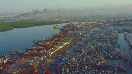 Shipyard aerial view passing from hundereds of ships.