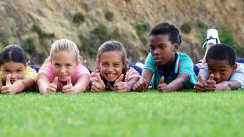 School kids lying on playground