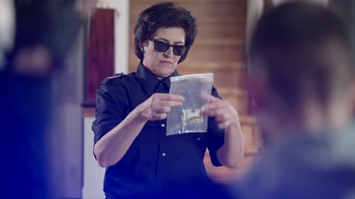 Police Officer Holds Money Evidence Bag