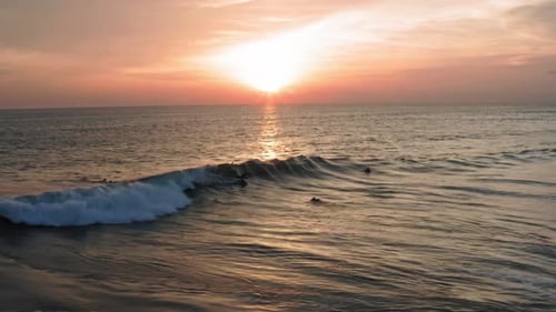 Aerial View of Body Surfer Riding Sunset Ocean Wave. Drone Shot Surfing Ocean Lifestyle, Extreme