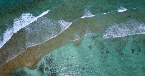 Wide angle overhead abstract view of a white paradise beach and aqua turquoise water background in b