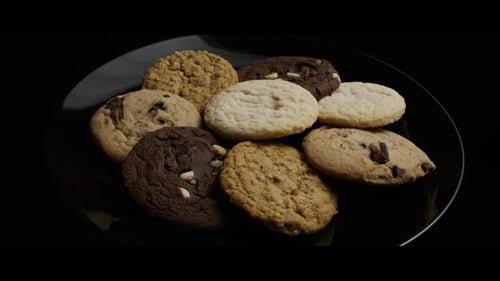 Variety of Delicious Cookies Displayed on Black Plate