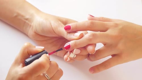 Hands Having Manicure and Nail Polish Applied