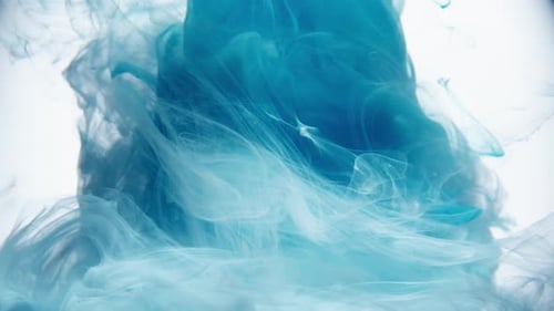 Abstract Turquoise and Blue Ink Swirling in Liquid