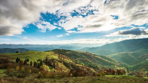 Time Lapse of Blue Sky with Clouds Over Mountain