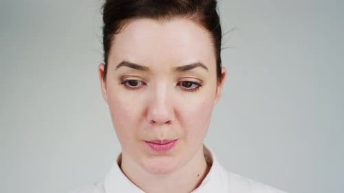 Close up of a woman looking hopelessly