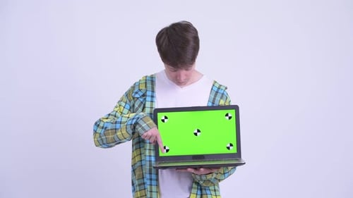 Young Adult Presenting Laptop with Green Screen