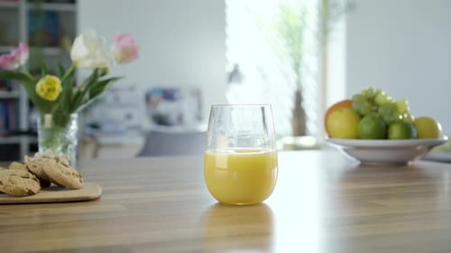 Glass of Orange Juice on Table With Food