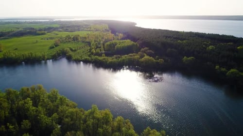 Flying Over the Beautiful Spring River. Aerial Camera Shot. Ukraine
