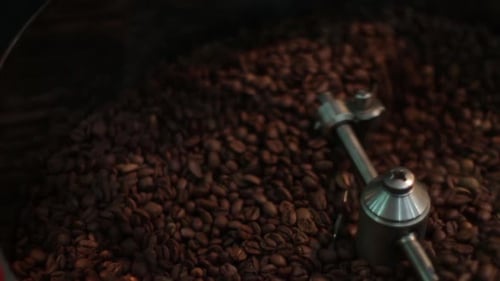 Coffee Beans Roasting in Machine Close Up