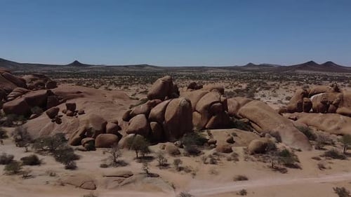 Aerial footage of the desert region Erongo, round rocks and small plants