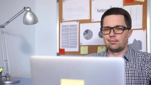 Office Worker Using Computer To Work in Network.