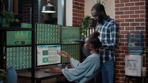 Team of Brokers Using Stock Market Sales Numbers to Create Capital Profit