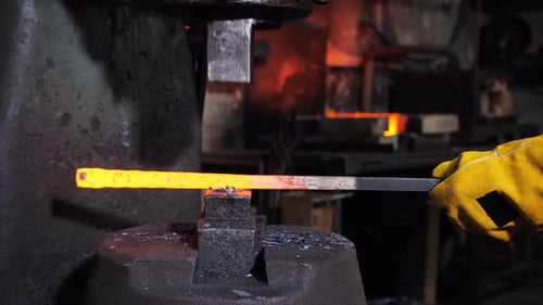 Industrial Forge Machine Shaping Heated Metal Bar