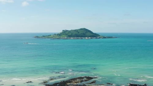 A view of the clear blue sea and the island. Jeju Island.