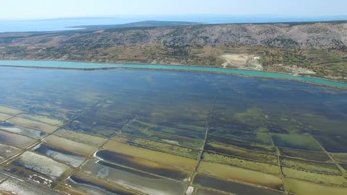360 view of salt pans surrounded by sea and mountains of Pag island, Croatia