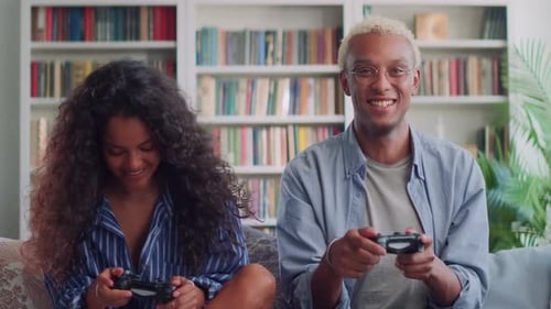 Friends Playing Video Games at Home on Couch