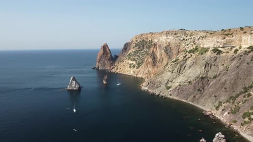 Aerial View From Above on Calm Azure Sea and Volcanic Rocky Shores