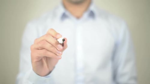 Man Writes Apply Now on Clear Surface