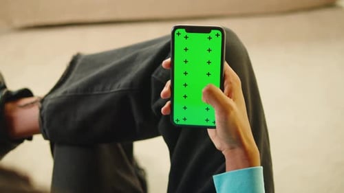African American Man Using Smartphone with Chroma Key Closeup