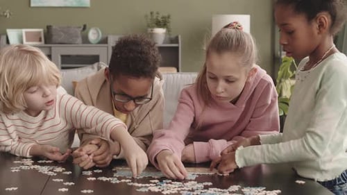 Multiethnic Kids Solving Jigsaw Puzzle Together