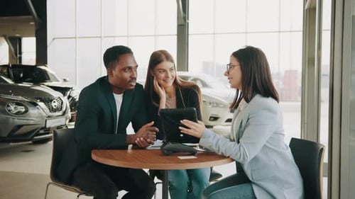 Young Adults Buying a Car From Dealership