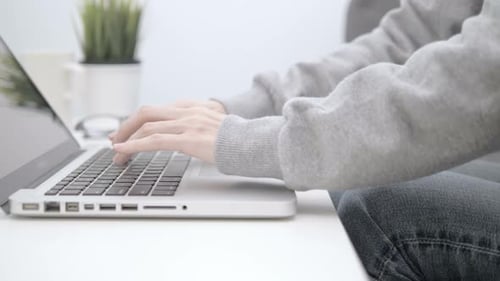 Typing On Laptop