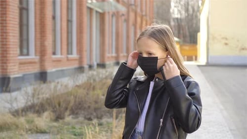 Girl Wearing a Mask Protect Against Coronavirus and Gripp