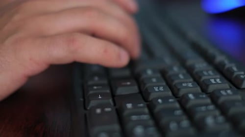 Office Worker Typing on Keyboard