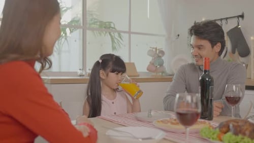 Family Celebrates Holidays at Home with Dinner