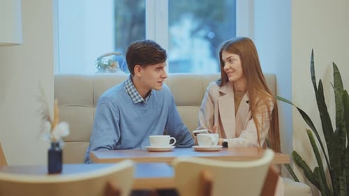Man and Woman Having Romantic Date in Cafe