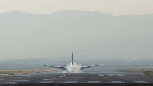 Airplane Landing At Airport Runway