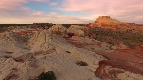 Rising view over desert terrain at sunrise