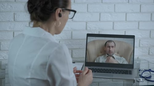 Doctor Consults Sick Patient Online