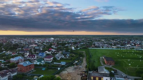 Aerial View of a Quiet Town at Sunset
