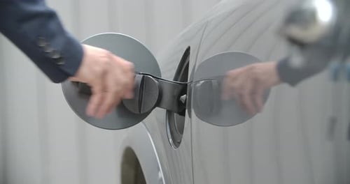 Charging Electric Car with Blue Charging Cable