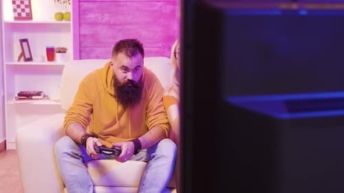 Couple Playing Video Games at Home