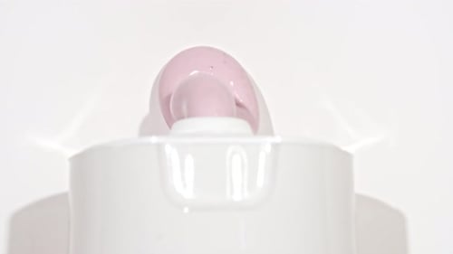 Squeezing Pink Cream from a Tube, Close Up