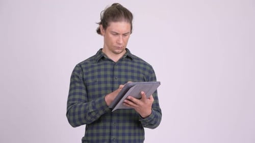 Man Using Tablet Shows Thumbs Down