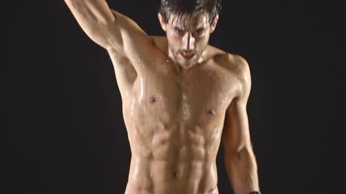 Shirtless Boxer Training with Intensity