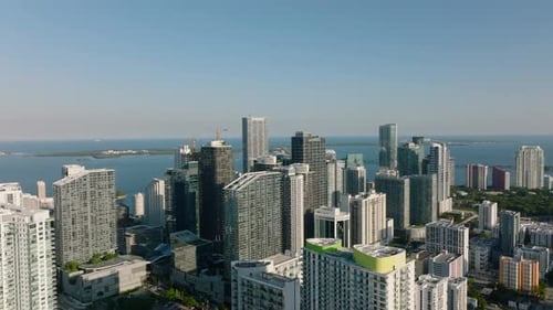 Ascending Panoramic Footage of Coastal Borough with Modern High Rise Apartment Buildings