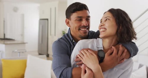 Loving Couple Embracing in Modern Home