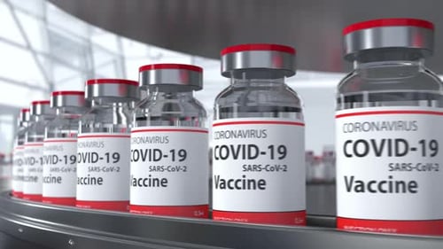 Bottles with COVID-19 vaccine on conveyor line at pharmaceutical industry loop 4k