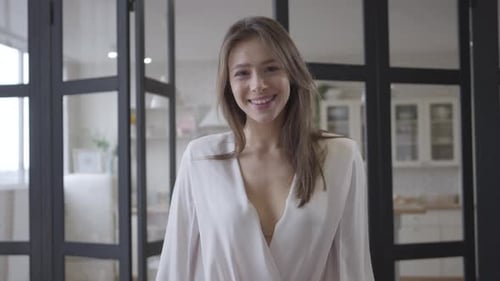 Smiling Woman Poses at Home in Daytime