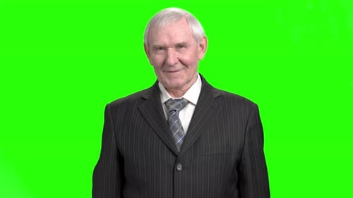 Smiling Man in Suit Gives Thumbs Up