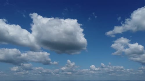 4k. Aerial view. The drone flies over foggy and fluffy clouds. Blue sky sun. Abstract aerial nature