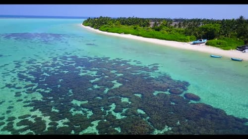 Aerial flying over travel of exotic island beach trip by turquoise ocean with white sandy background