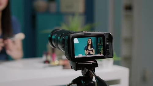 Woman Films Makeup Tutorial for Beauty Vlog