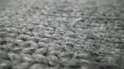 Extreme Detail View of Sheep Wool Cloth Texture Flowing in Macro Dolly Shot